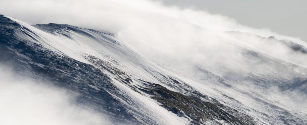 Mist flowing down from a mountain.